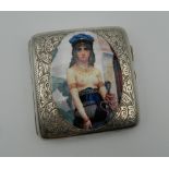 A silver cigarette case depicting a semi-clothed lady. 7.5 cm wide.