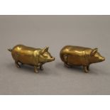A Victorian brass pig form vesta and a pig form taper holder. The former 5 cm wide.