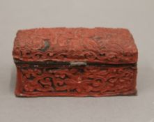 A small cinnabar dome top casket. 8.5 cm wide.