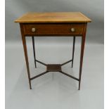 An Edwardian crossbanded mahogany single drawer side table. 58 cm wide.