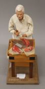 A model of a butcher. 31 cm high.