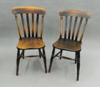 Two Victorian elm seated splat back kitchen chairs. 44 cm wide.
