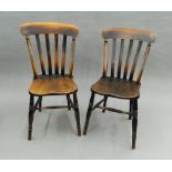 Two Victorian elm seated splat back kitchen chairs. 44 cm wide.