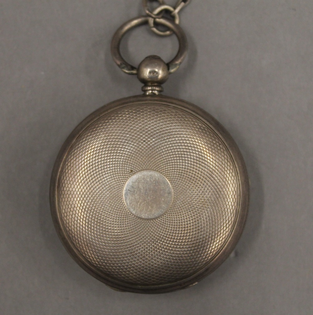 Two 19th century silver pocket watches on chains and a brass pocket watch case. - Image 7 of 12