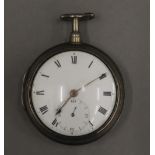 An early 19th century silver pair cased pocket watch.
