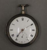 An early 19th century silver pair cased pocket watch.