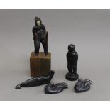 A collection of Inuit carvings. The largest 19 cm high overall.