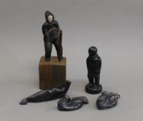 A collection of Inuit carvings. The largest 19 cm high overall.