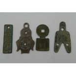 Four Chinese bronze archaic style pendants. The largest 6.5 cm high.