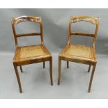 A pair of cane seated mahogany side chairs. 44 cm wide.