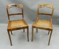 A pair of cane seated mahogany side chairs. 44 cm wide.