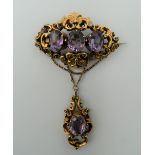 A Victorian amethyst set unmarked gold brooch. 13.8 grammes total weight.