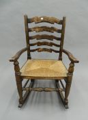 An oak ladder back rocking chair