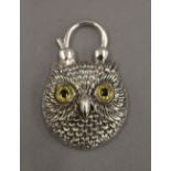A silver padlock formed as an owl. 4 cm high.