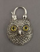 A silver padlock formed as an owl. 4 cm high.