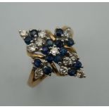 A 9 K gold diamond and sapphire ring. Ring Size M/N.