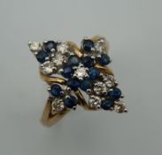 A 9 K gold diamond and sapphire ring. Ring Size M/N.