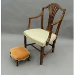 An Edwardian mahogany open armchair and a Victorian foot stool. The stool 35 cm wide.