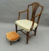 An Edwardian mahogany open armchair and a Victorian foot stool. The stool 35 cm wide.