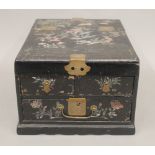 A Chinese lacquered table cabinet. 24 cm wide.