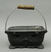 A cast iron carriage/foot warmer. 26 cm wide.