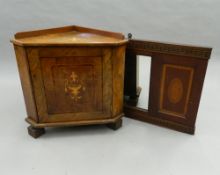 A small Victorian walnut corner cupboard, together with an inlaid mahogany mirror.