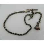 An unmarked silver watch chain, together with key and fob. 34 cm long.