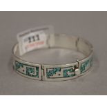 A silver and turquoise bracelet. 47.6 grammes.
