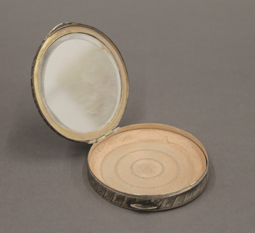 A silver enamel compact. 7 cm diameter. - Image 4 of 4