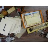 A wooden tray containing various collectable items.