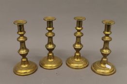 A set of four early 19th century candlesticks. 21 cm high.