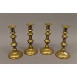 A set of four early 19th century candlesticks. 21 cm high.