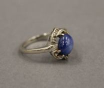 A 14 K white gold and star sapphire ring. Ring Size N.