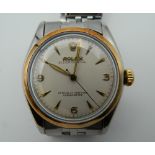A steel and gold bevel Rolex wristwatch. 3.5 cm wide.