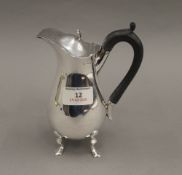 A silver bachelor's coffee pot, hallmarked London 1897. 16.5 cm high. 7.9 troy ounces total weight.