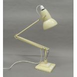 An angle poise lamp. 87.5 cm high.