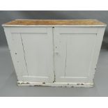 A Victorian painted pine side cupboard. 103 cm wide.