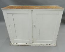 A Victorian painted pine side cupboard. 103 cm wide.