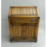 A 20th century linen fold fronted bureau. 74 cm wide.