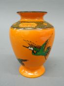 A Shelly orange ground vase.