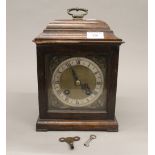 An early 20th century oak cased mantle clock. 29 cm high.