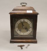 An early 20th century oak cased mantle clock. 29 cm high.