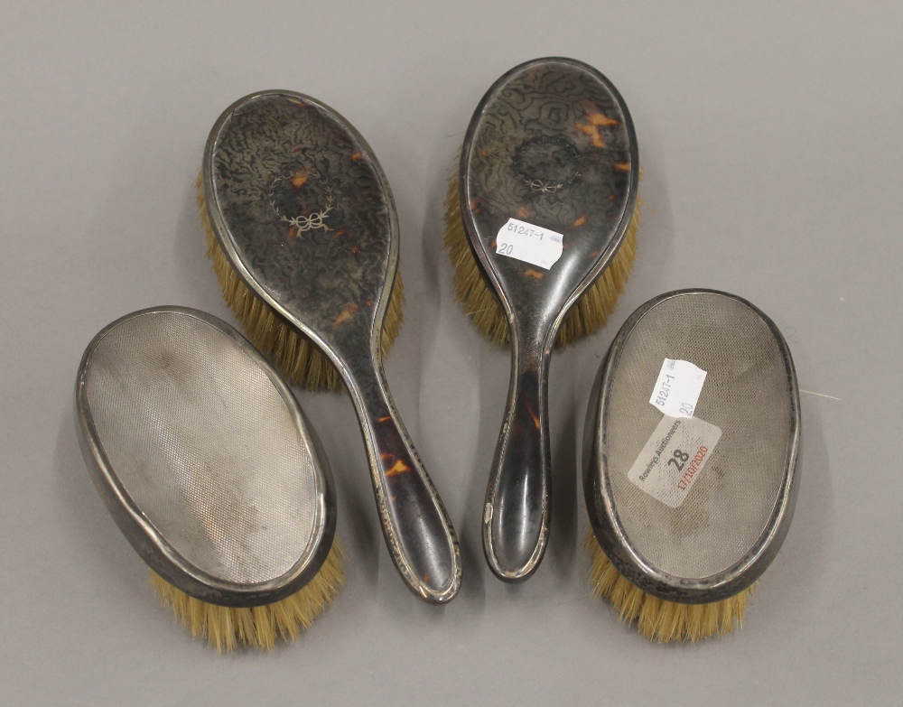 Two silver brushes,