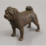 A bronze model of a pug. 7 cm long.