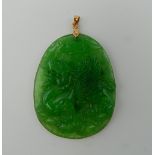 A Chinese carved jade pendant. 5.5 cm high.