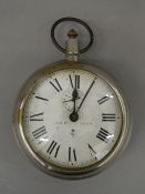 A late 19th/early 20th century alarm clock formed as a large pocket watch. 14.5 cm diameter.