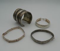 A small quantity of silver and other bracelets