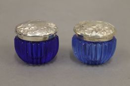 A pair of sterling silver Art Nouveau style glass pots. 4 cm high.