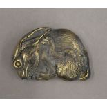 A brass vesta formed as a rabbit. 6 cm wide.