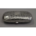 A Russian silver niello cigarette case. 8.5 cm wide.